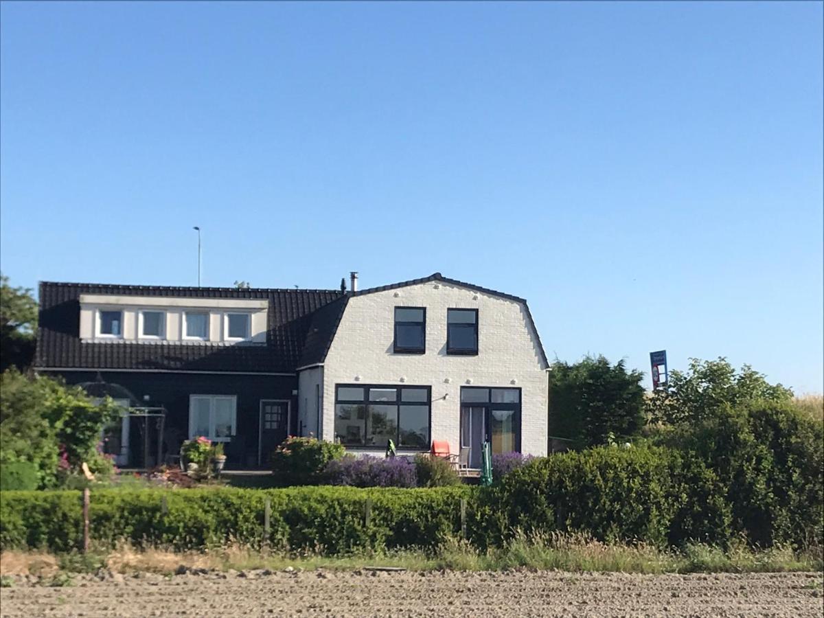 T Huuske Tuinappartement Met Fantastisch Uitzicht, Nabij Zee Zonnemaire Dış mekan fotoğraf